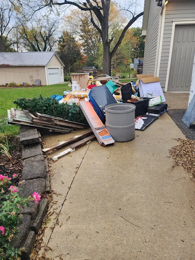 Dumpster being loaded with debris for 30 Yard Dumpster Rental in Whiting